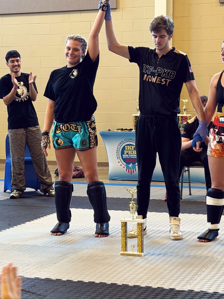 A referee raises the hand of a TCB fighter at an IKF event.
